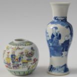 A Chinese blue and white porcelain baluster vase decorated with scholars on a pavilion,