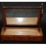 A George III mahogany toilet mirror with boxwood stringing,