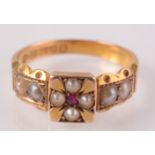 A 15ct gold Victorian ring with a pearl and ruby Maltese cross flanked by pearl shoulders,