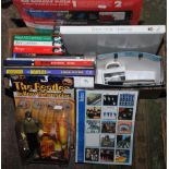 A box of Beatles related books, a Yellow Submarine figure and toy etc.