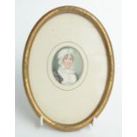 A 19th century miniature portrait of a lady wearing a mop cap.