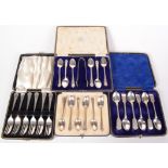 A set of six pre war cake forks, cased, a set of six silver coffee spoons, cased,