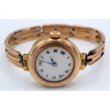 A ladies Stauffer 9ct gold cased wristwatch with expanding gold bracelet.