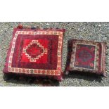 Two Persian wool covered cushions, each with a central hooked gul medallion, kelim backs,