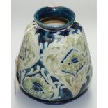 A William Moorcroft pottery vase with tapered body and narrow neck,
