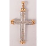 A 9ct yellow and white gold, diamond set cross.