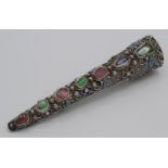 A Chinese silver filigree and enamel nail guard brooch set a row of seven coloured stones.