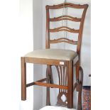 A Reprodux ladder back dining chair on square section moulded legs.