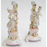 A pair of continental porcelain four branch candelabra,