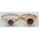 Two 9ct gold rings, each set a garnet.