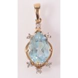 A diamond and blue stone set 9ct gold pendant.