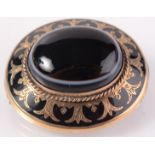 A Victorian gold banded agate and black enamel brooch.