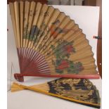 A large Chinese painted paper fan,