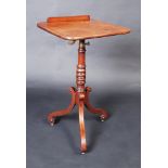 A Regency mahogany music stand with rectangular top on adjustable brass sector with removable