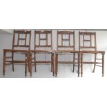 A set of four high Victorian chairs with rush seats.