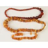 Two amber necklaces and an amber style necklace.