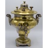 A Russian brass samovar, with maker's mark to cover and turned wood handles, height 40cm.
