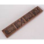 A carved wood gingerbread mould, 37.5 x 6.5cm.