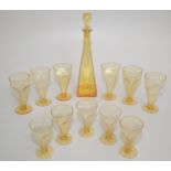 A set of eleven Art Deco design amber glasses and decanter,