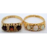 An 18ct gold ring set opals and diamonds, together with an 18ct gold ring set diamonds and garnets.
