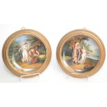 A framed pair of Vienna painted porcelain plates, 19th century,