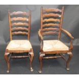 A set of five ladder back chairs, including a single carver, grass seats,