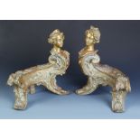 A pair of fine French bronze chenets in Louis XV style each with a female bust. Height.37 cm.