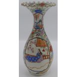 A Japanese Kutani vase of baluster form with a waisted neck supporting a broad rimmed, fluted edged,