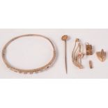 An opal set gold bangle, two gold charms and other gold, 8.5g.