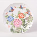 A Chinese famille rose porcelain plate, 20th century, decorated peonies, moths and butterflies,