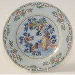 An English delft pottery polychrome plate, 18th century, bearing a label 'probably Bristol c1730',