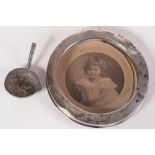 A silver bowl of a George III toddy ladle, together with a silver mounted photograph frame.