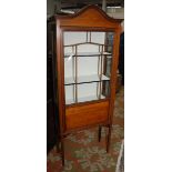 An Edwardian inlaid mahogany narrow glazed cabinet.