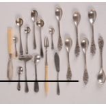 Silver condiment spoons and other cutlery including silver coloured metal.