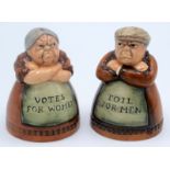 A pair of Royal Doulton salt and pepper pots entitled 'Votes for Women' and 'Toil for Men',