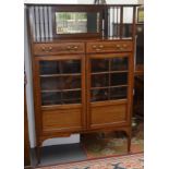 An Edwardian mahogany display cabinet in Arts and Crafts style,