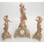 An early 20th century spelter and onyx clock garniture,