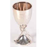 A silver golfing cup, the stem with three clubs inscribed 'Derby Golf Cup Competition 1935'. 4oz.