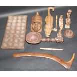 An Aboriginal woomera, length 57.5cm and miscellaneous African and Oceanic tribal items.