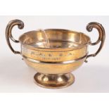 An Edwardian footed bowl with twin rising scroll handles Birmingham 1907, diameter 12.5cm. 7oz.