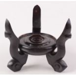 A Chinese carved hardwood stand, maximum height 19cm, diameter of base 14.5cm.