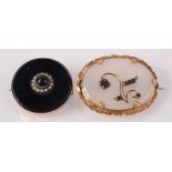 A Victorian mourning brooch and one other Victorian brooch.