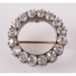 A late Victorian diamond circle brooch, each stone of approximately 0.