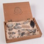A wooden box containing a quantity of arrowheads and microliths,