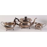 A plain oval three piece silver tea service, Birmingham 1913. 40oz.