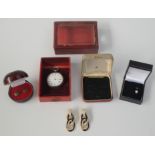 A silver cased fob watch in leather bound travelling case etc.