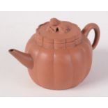 A Chinese Yixing teapot of lobed pumpkin like rounded body style,