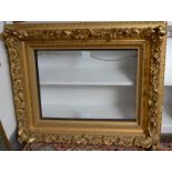 An ornate 19th century gilt picture frame, internal dimensions 46 x 61cm.