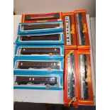 Ten boxed carriages by Hornby and Airfix.