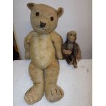 A Kapok filled teddy bear and a fur fabric wired monkey each worn.